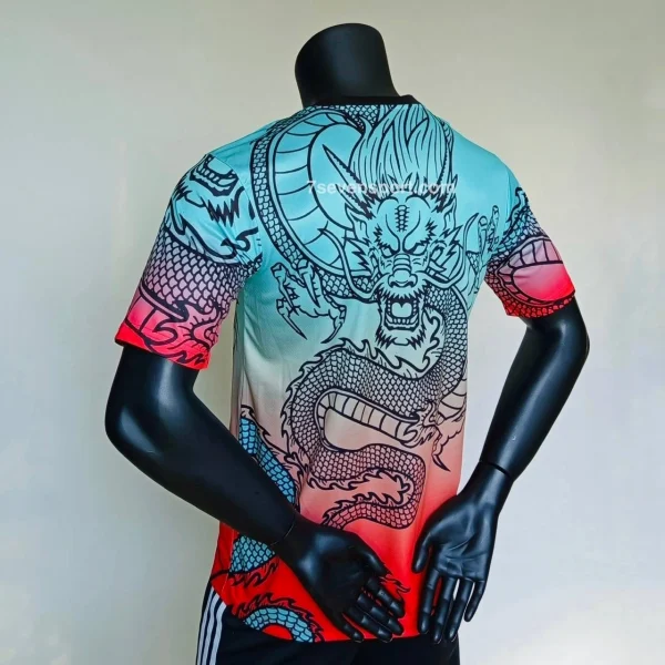 کیت رئال مادرید دراگون فیروزهای قرمز کانسپت 2025 - سون اسپرت